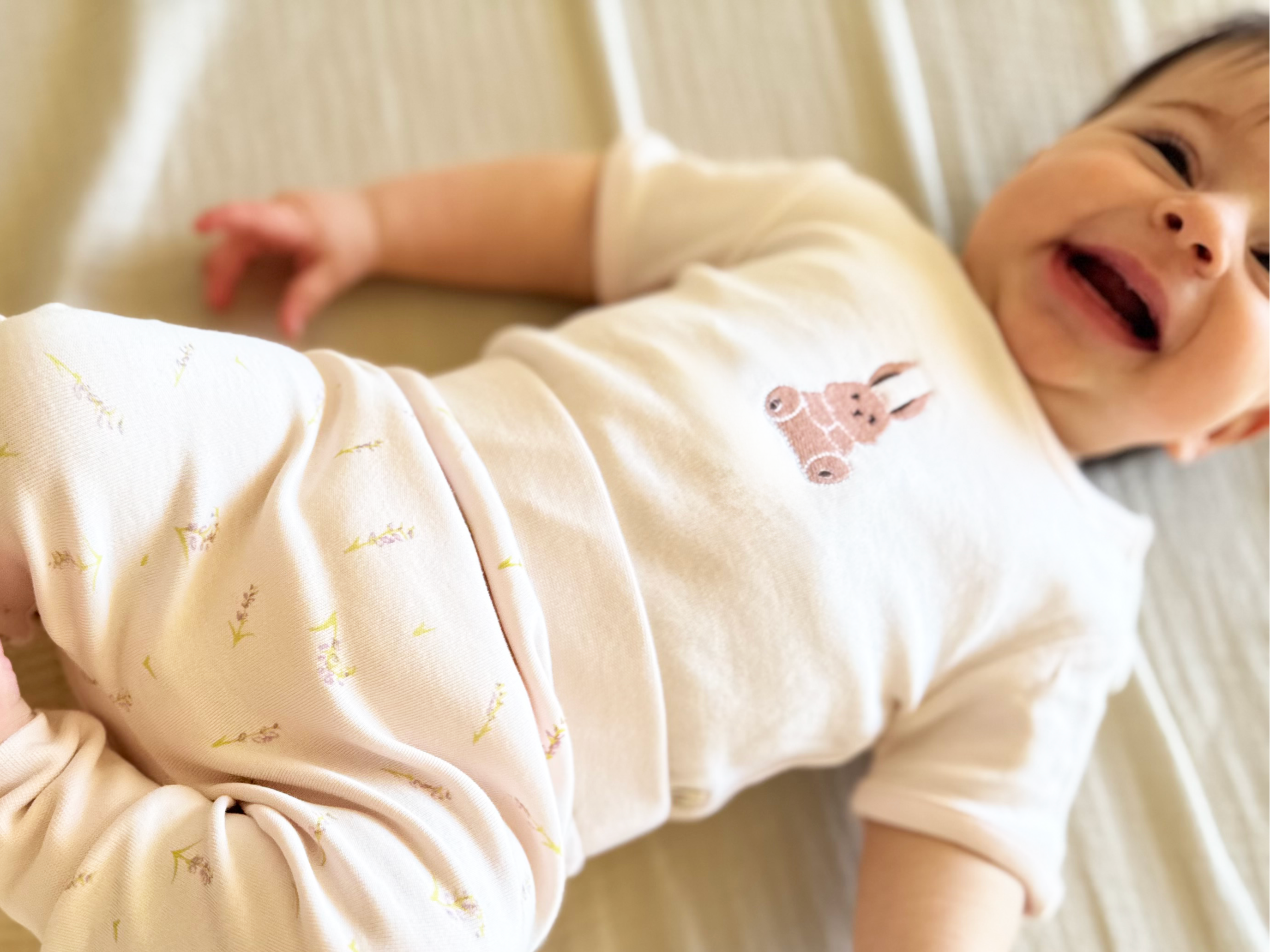Baby in lavender and bunny themed bodysuit and pants