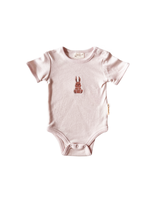 Baby bodysuit with a small design on a white background