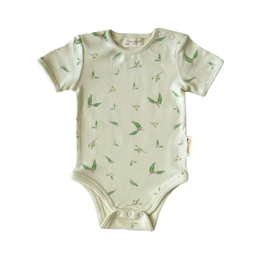 Baby onesie with green leaf pattern on a white background