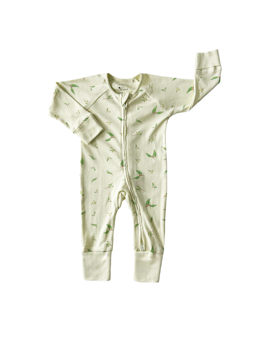 Green baby onesie with a pattern on a white background