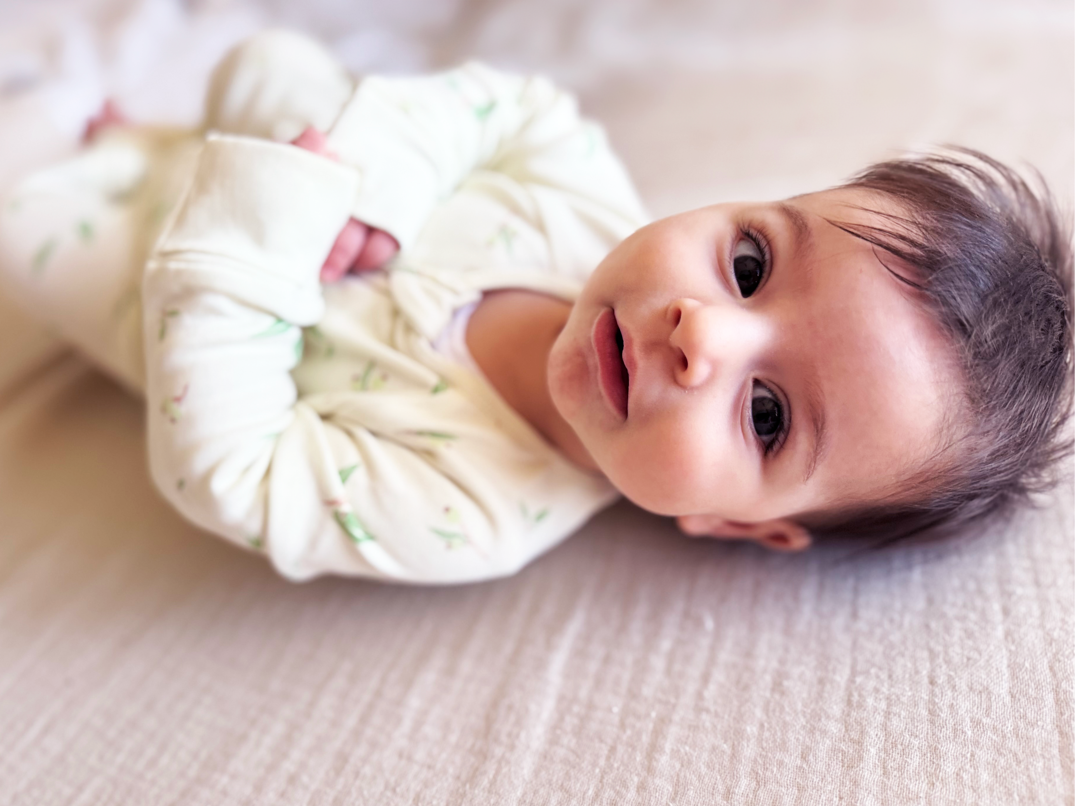 Baby in a Eucalyptus print baby onesie / growsuit / romper