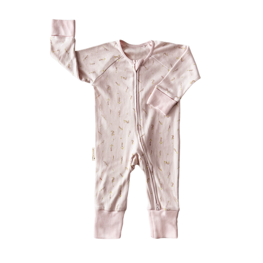 Pink baby onesie with a zipper on a white background