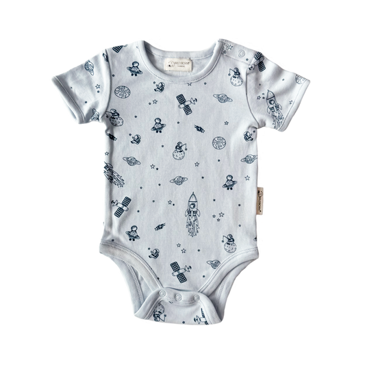 Baby onesie with space-themed print on a white background